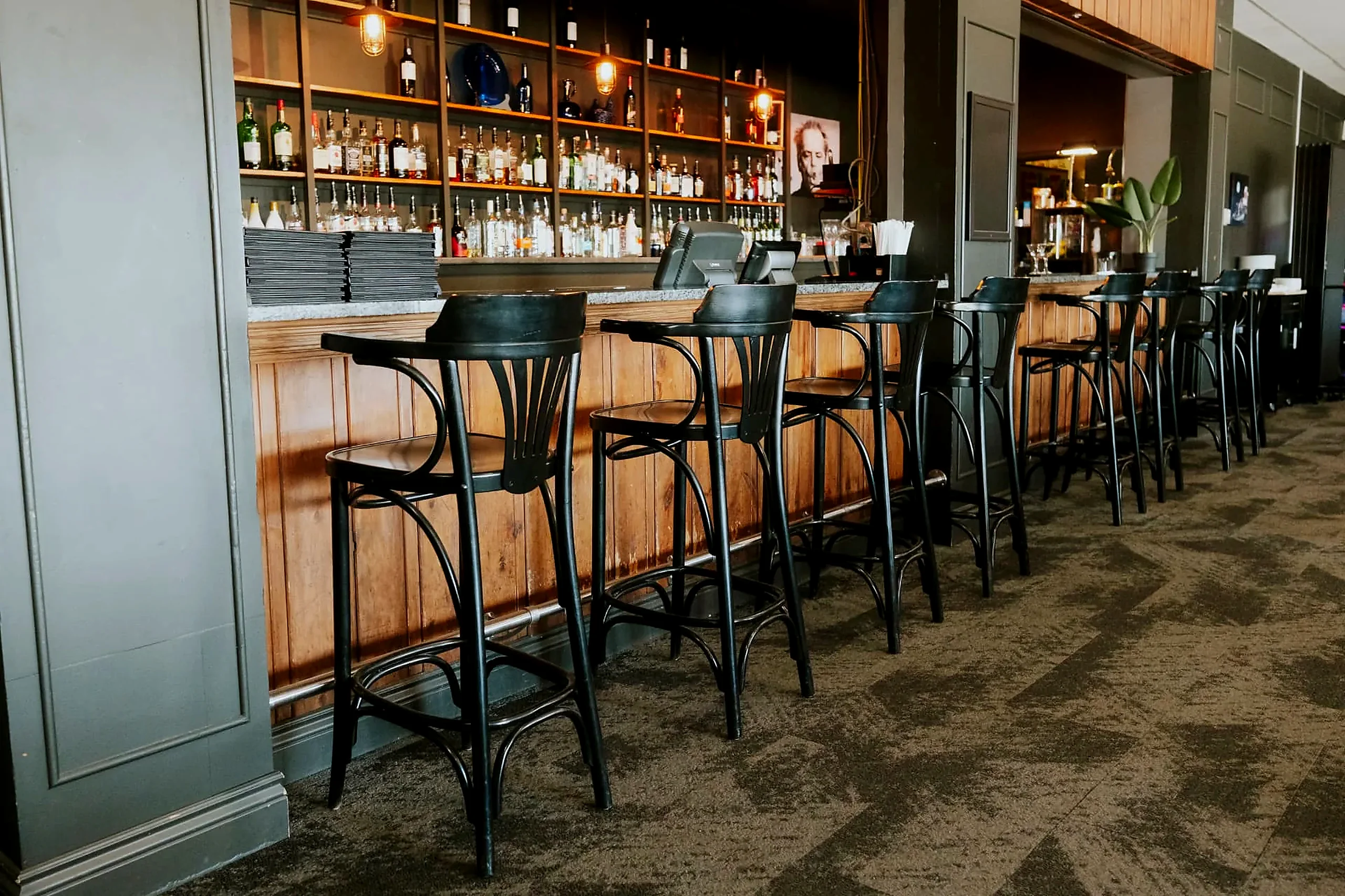 Row of stools along the bar at the Wabush Hotel, open until midnight