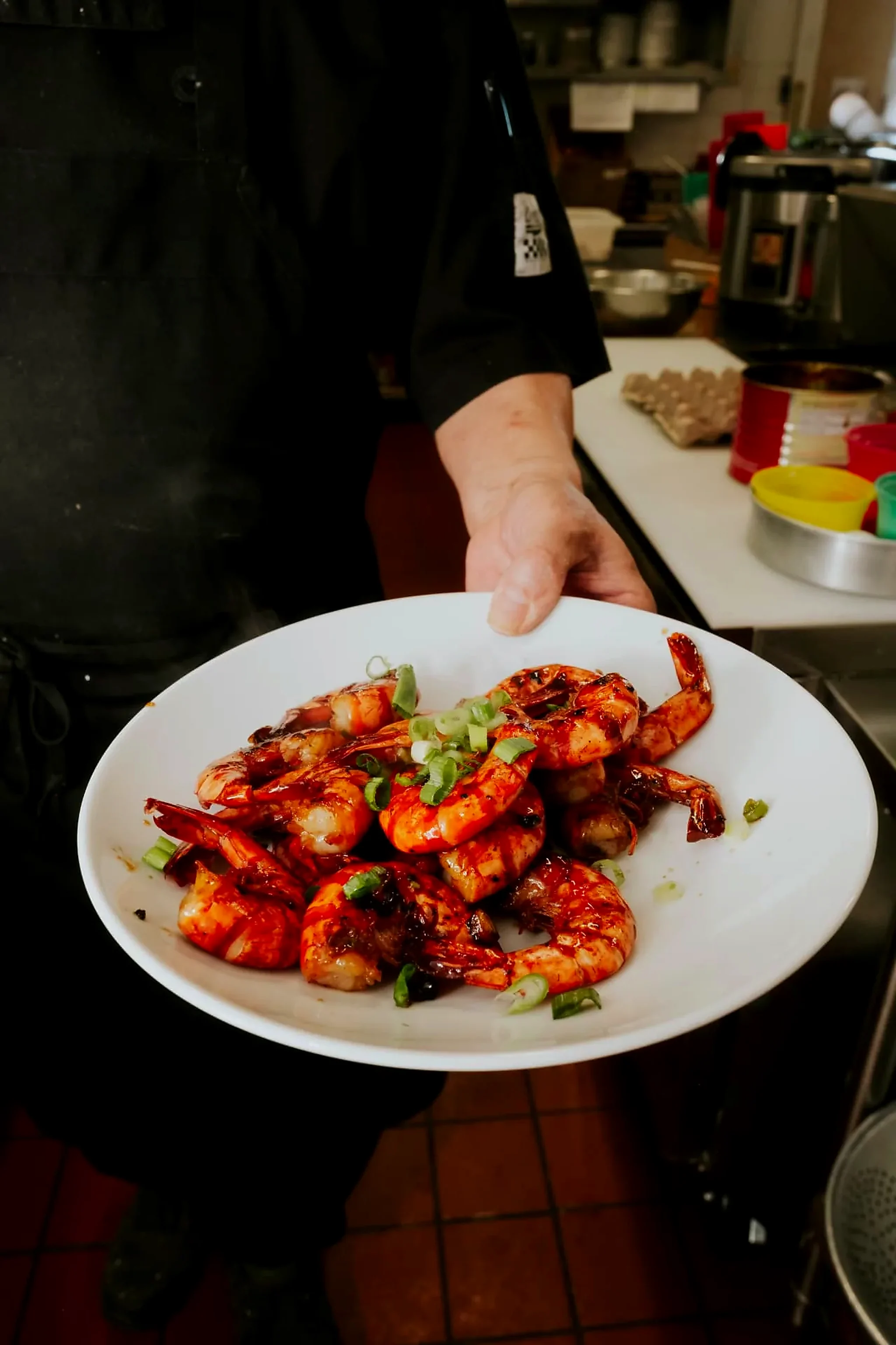 A plate of grilled garlic shrimp served at the Frozen Rooster