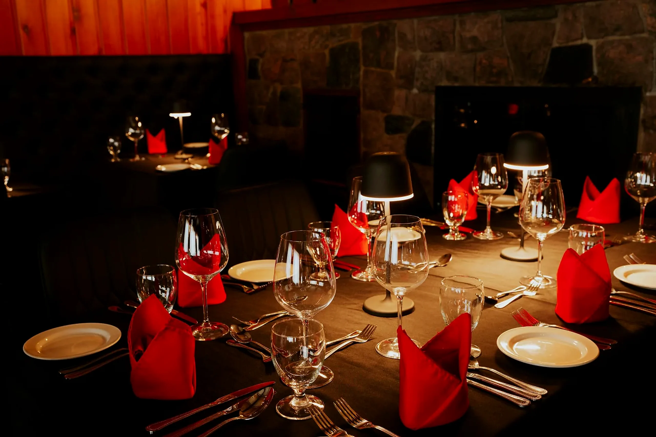 Dinner without leaving the building Table set with red napkins beside the fireplace in the hotel restaurant, one floor below the rooms
